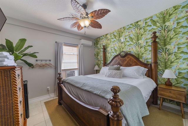 bedroom featuring a wall mounted air conditioner, cooling unit, ceiling fan, a textured ceiling, and light tile patterned flooring