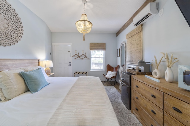 bedroom featuring dark hardwood / wood-style flooring, an inviting chandelier, and a wall unit AC