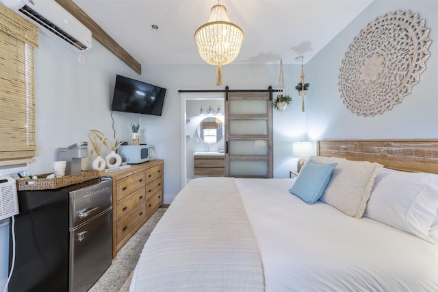 carpeted bedroom featuring beam ceiling, connected bathroom, a wall mounted air conditioner, an inviting chandelier, and a barn door