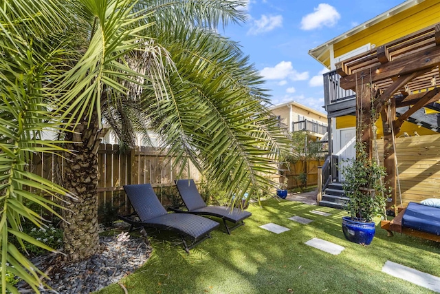 view of yard featuring a balcony