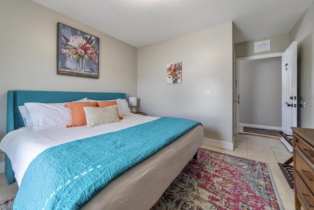 2 Mulvey St, Saint Augustine, FL 32084 - bedroom with light tile patterned floors and baseboards