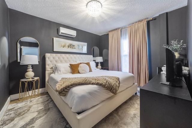 carpeted bedroom with a wall mounted AC, a textured ceiling, and a notable chandelier