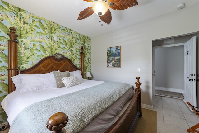 bedroom with ceiling fan and light tile patterned flooring