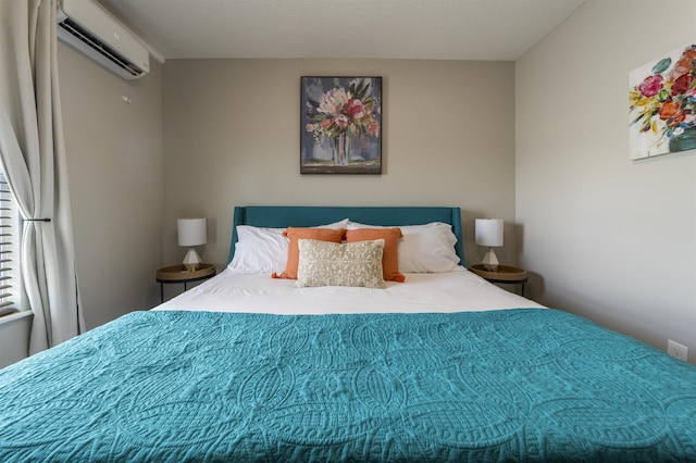 bedroom with a wall mounted air conditioner