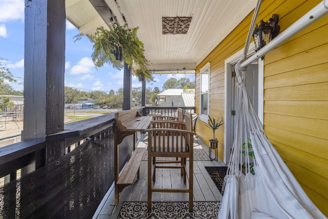 wooden deck featuring covered porch