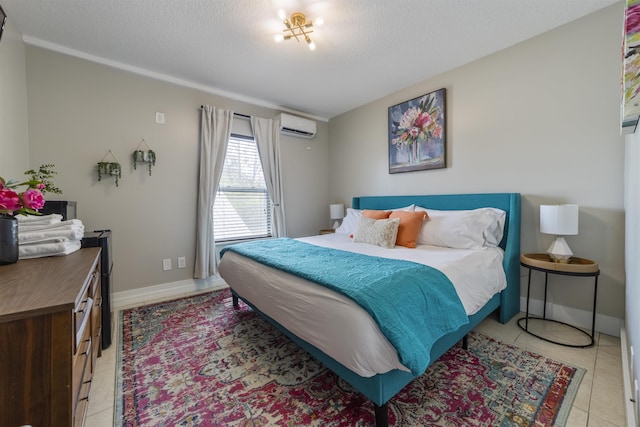 bedroom featuring a textured ceiling, light tile patterned floors, and a wall mounted air conditioner