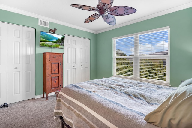 210 16th Street Unit J, Saint Augustine Beach, FL 32080 - carpeted bedroom featuring multiple closets, crown molding, and ceiling fan