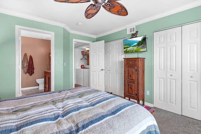 210 16th Street Unit J, Saint Augustine Beach, FL 32080 - carpeted bedroom with washer and dryer, two closets, ornamental molding, ensuite bathroom, and a ceiling fan