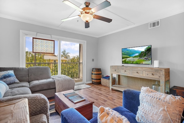 210 16th Street Unit J, Saint Augustine Beach, FL 32080 - living room featuring crown molding, wood finished floors, and ceiling fan