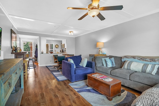 210 16th Street Unit J, Saint Augustine Beach, FL 32080 - living room featuring wood finished floors, ceiling fan, coffered ceiling, and ornamental molding
