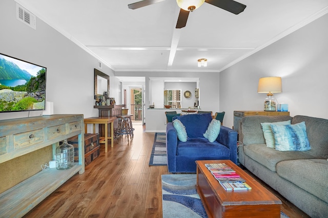 210 16th Street Unit J, Saint Augustine Beach, FL 32080 - living area featuring wood finished floors, ceiling fan, ornamental molding, and coffered ceiling