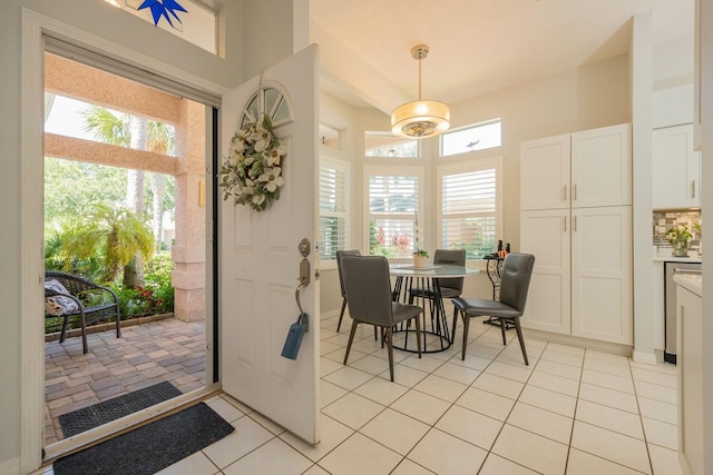 dining space featuring plenty of natural light and light tile patterned floors