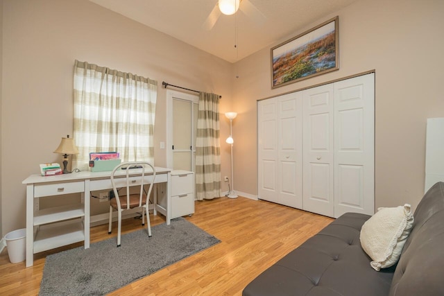 office area with ceiling fan and light hardwood / wood-style flooring