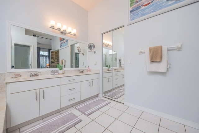 bathroom with tile patterned flooring and vanity