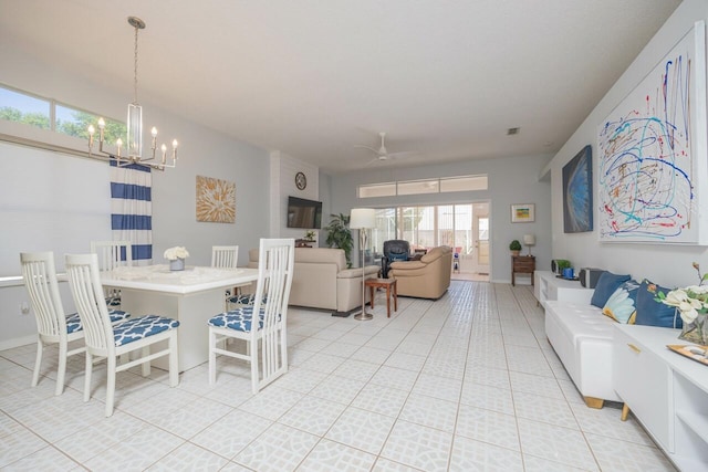 dining space with ceiling fan with notable chandelier and light tile patterned flooring