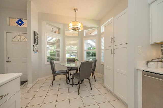 dining space featuring light tile patterned floors