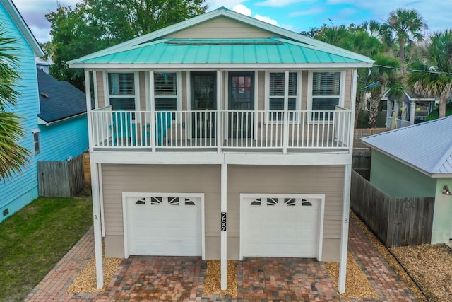 back of house featuring a garage