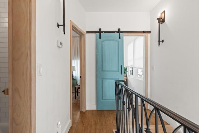 91 Oneida St, Saint Augustine, FL 32084 - hallway featuring an upstairs landing, baseboards, and wood finished floors