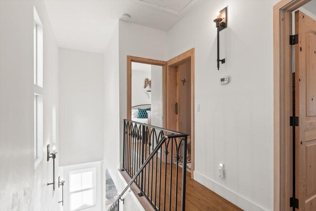91 Oneida St, Saint Augustine, FL 32084 - corridor with baseboards, an upstairs landing, and wood finished floors
