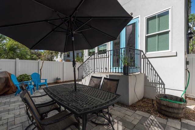 91 Oneida St, Saint Augustine, FL 32084 - view of patio / terrace with a fenced backyard and outdoor dining area
