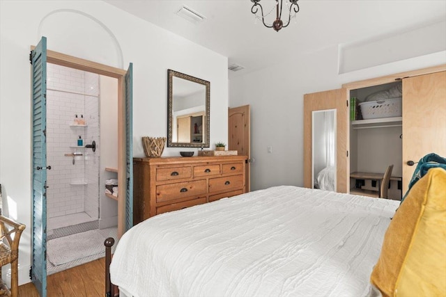 91 Oneida St, Saint Augustine, FL 32084 - bedroom featuring a closet, wood finished floors, ensuite bathroom, and visible vents