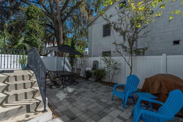 91 Oneida St, Saint Augustine, FL 32084 - view of patio / terrace featuring a fenced backyard and outdoor dining space