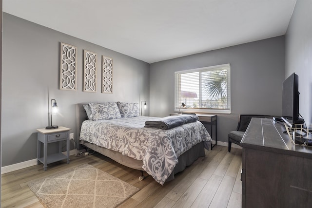 bedroom with light hardwood / wood-style floors