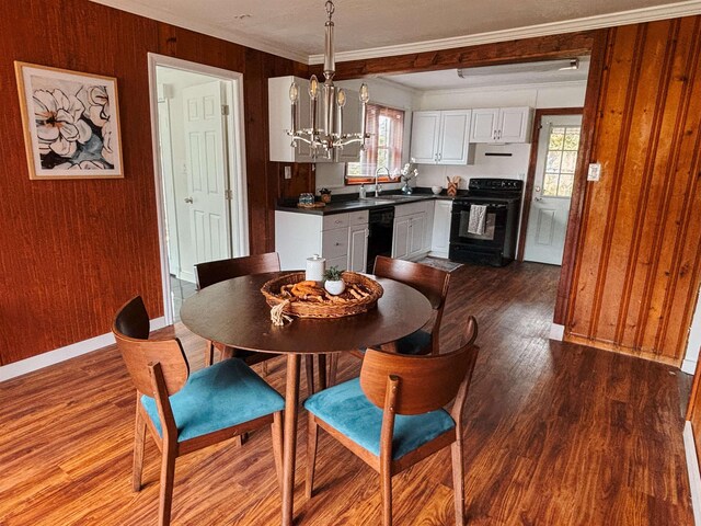 240 Ravenswood Dr, Saint Augustine, FL 32084 - living area with wood finished floors, ceiling fan, and wood walls