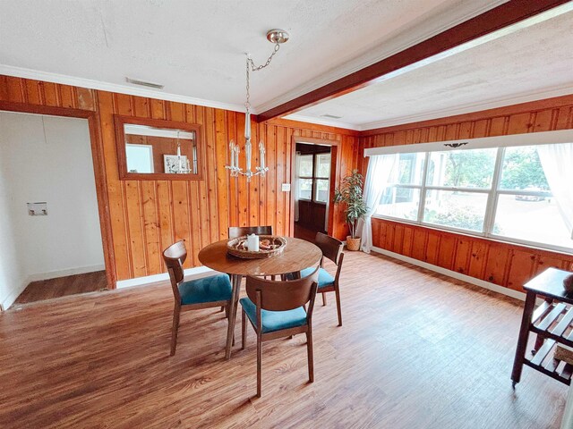 240 Ravenswood Dr, Saint Augustine, FL 32084 - living area featuring wood finished floors, a ceiling fan, and wood walls