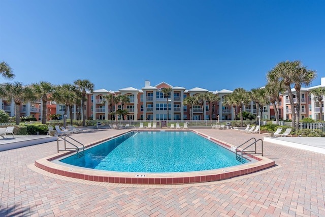 view of swimming pool featuring a patio area