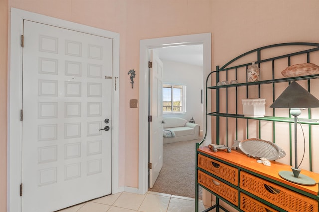 hallway featuring light tile patterned floors