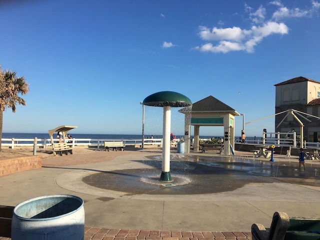 view of community with a water view