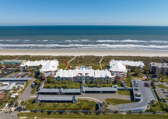 aerial view featuring a water view and a beach view