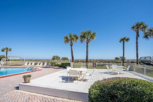 view of swimming pool with a patio