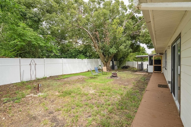 view of yard with a fire pit