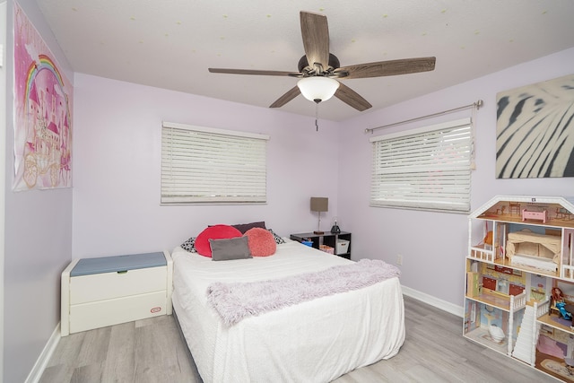 bedroom featuring ceiling fan and hardwood / wood-style floors