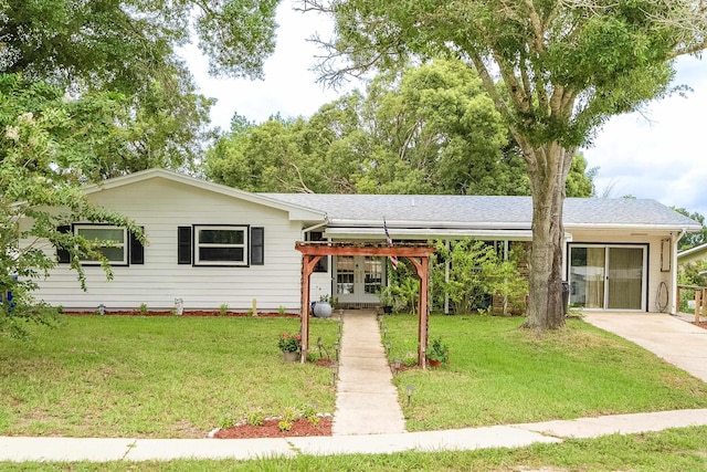 ranch-style house with a front yard and french doors