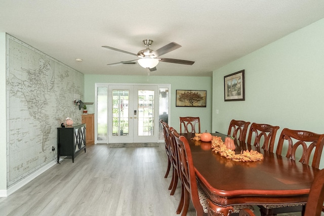 dining room featuring french doors, ceiling fan, and light hardwood / wood-style floors