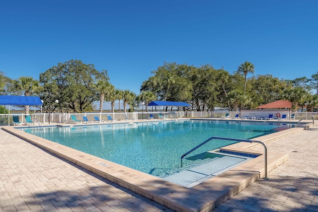 view of swimming pool with a patio area