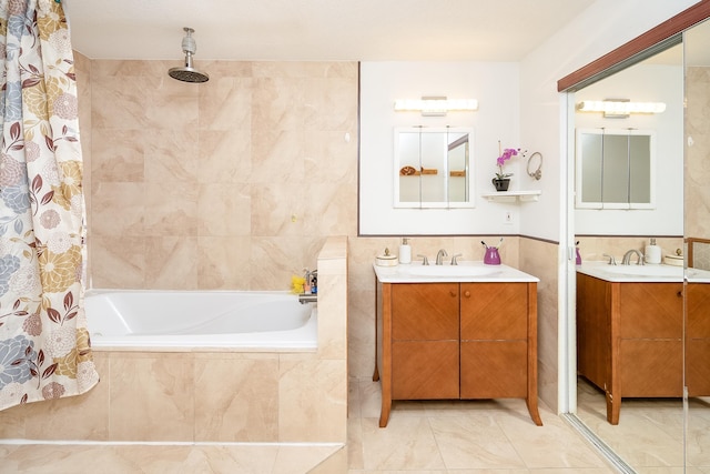 bathroom featuring vanity and tile walls