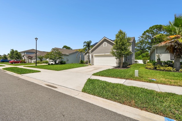 view of front of home featuring a garage and a front yard