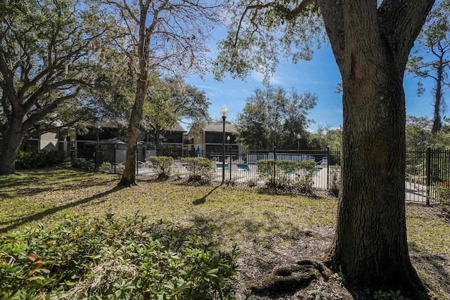 view of yard with a community pool