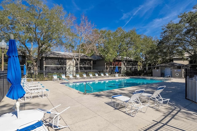 view of swimming pool with a patio