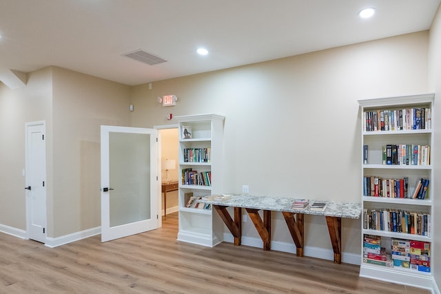 playroom featuring light wood-type flooring