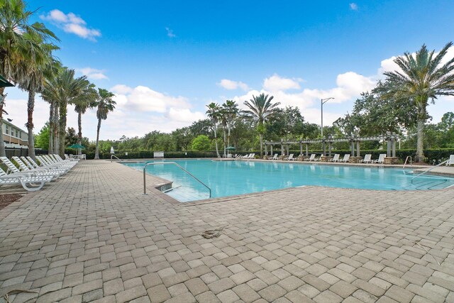 view of swimming pool featuring a patio