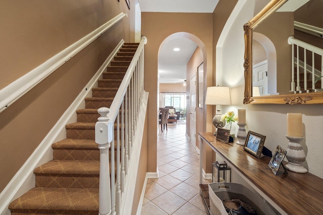 stairway featuring tile patterned floors