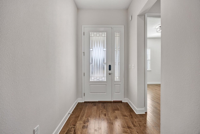 foyer entrance with dark hardwood / wood-style floors