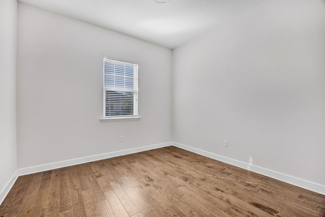 spare room featuring hardwood / wood-style flooring