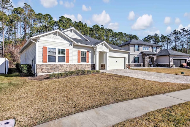 view of front of property featuring a garage and a front yard