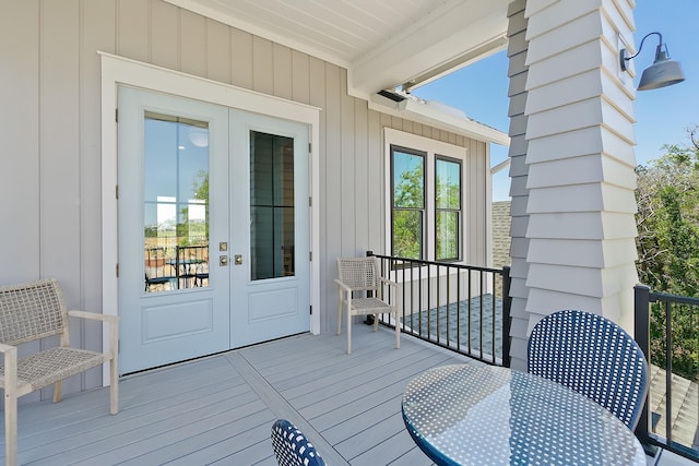 214 Pelican Reef Dr, Saint Augustine, FL 32080 - wooden terrace featuring french doors and outdoor dining area